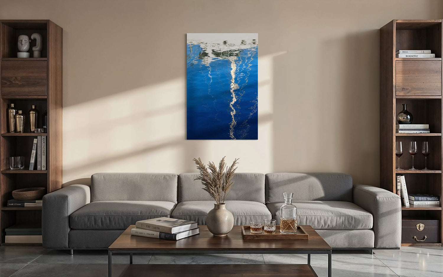 An abstract photo of a sailboat being reflected in the blue water of the San Francisco Marina hangs in a living room. | Lars Gesing Fine Art | Nautical Wall Art