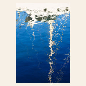 An abstract photo of a sailboat being reflected in the blue water of the San Francisco Marina. | Lars Gesing Fine Art | Nautical Wall Art