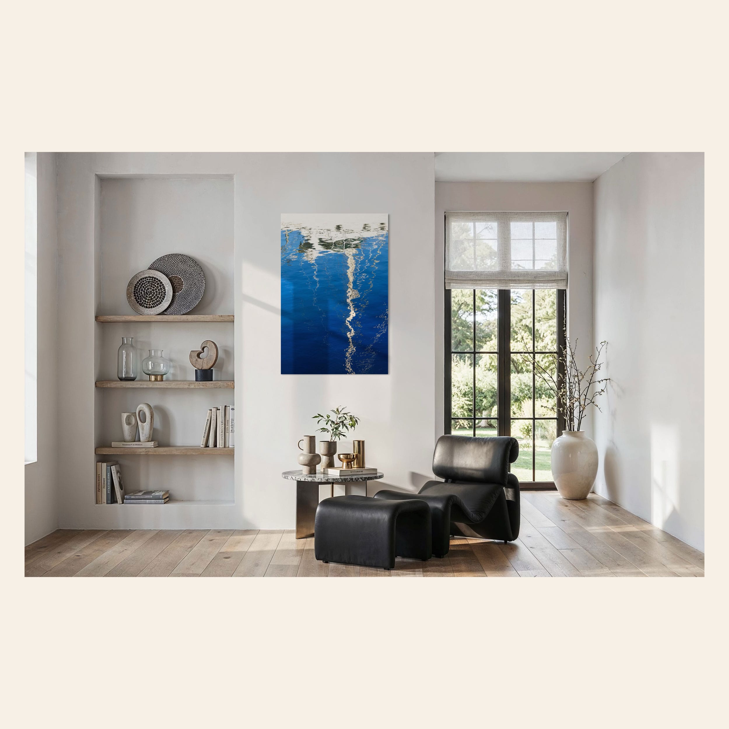 An abstract photo of a sailboat being reflected in the blue water of the San Francisco Marina hangs next to a comfy chair. | Lars Gesing Fine Art | Nautical Wall Art