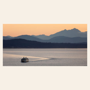 A piece of Seattle wall art photography shows a ferry approaching.