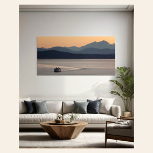 A piece of Seattle wall art photography showing a ferry approaching hangs in a living room.