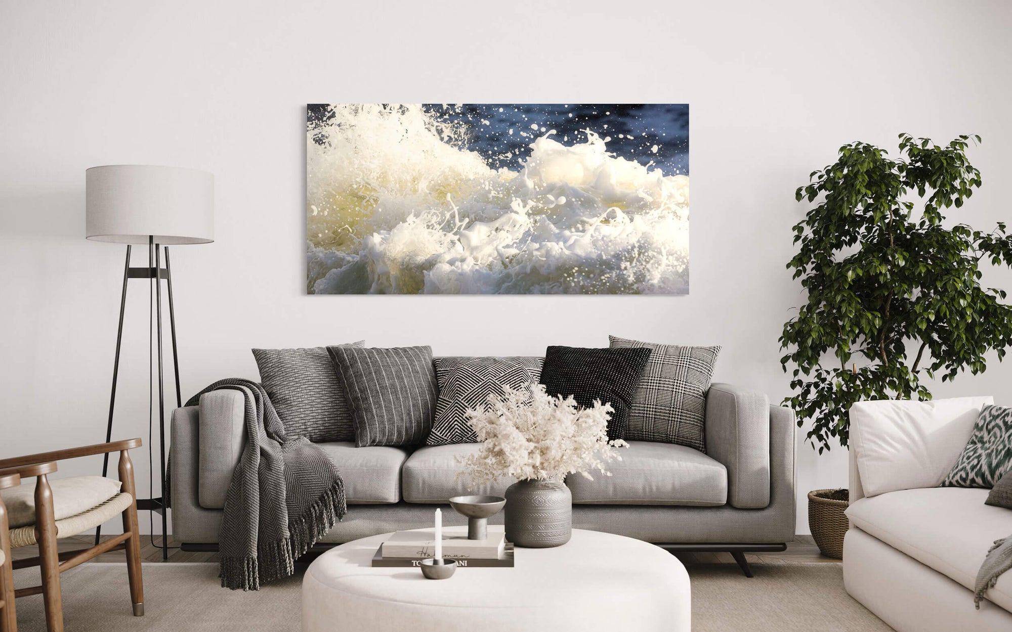 A Shark Fin Cove picture of waves near Big Sur, California hangs in a living room.