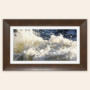 A piece of framed Big Sur ocean art shows waves at Shark Fin Cove.