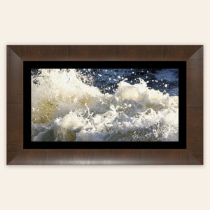 A piece of framed Big Sur ocean art shows waves at Shark Fin Cove.