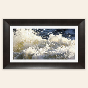 A piece of framed Big Sur ocean art shows waves at Shark Fin Cove.