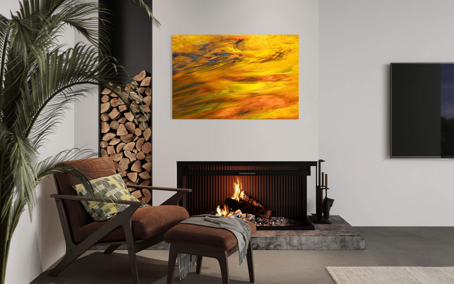 A picture of the fall colors at Silver Falls State Park in Oregon hangs in a living room.