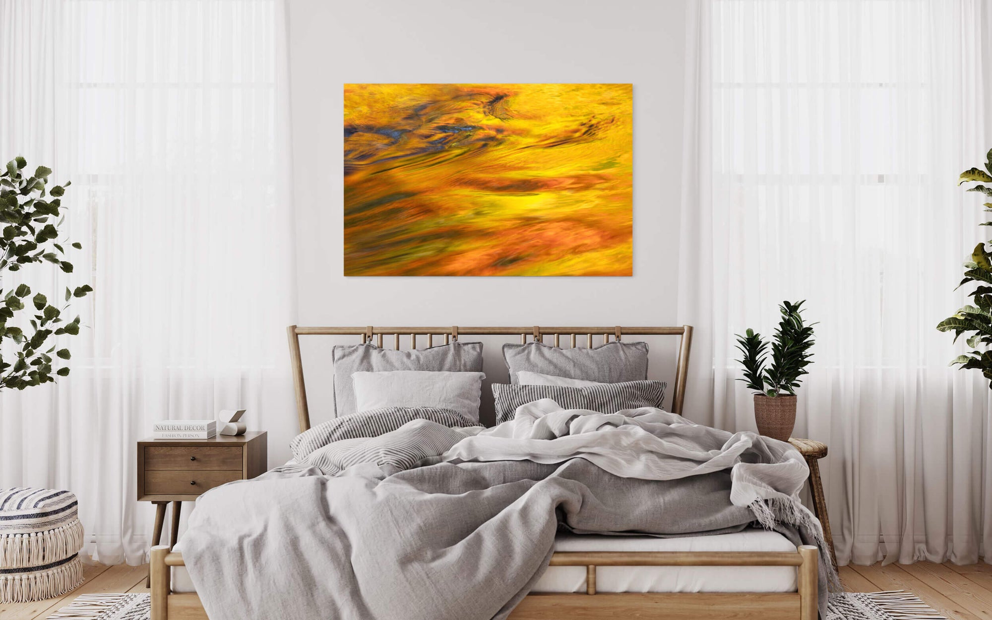 A picture of the fall colors at Silver Falls State Park in Oregon hangs in a bedroom.