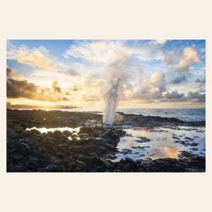 A piece of Kauai art shows a Spouting Horn photo.