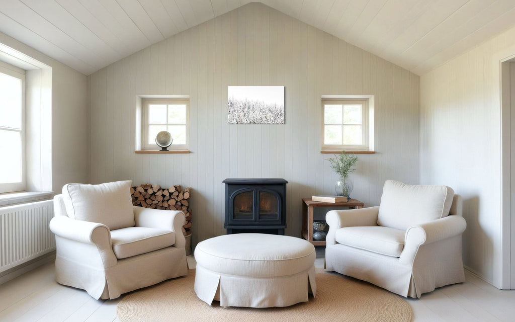 A piece of Steamboat Springs art showing snowy trees outside the Colorado ski resort hangs above a wood-burning stove.