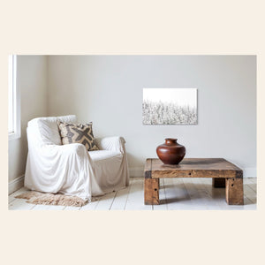 A piece of Steamboat Springs art showing snowy trees outside the Colorado ski resort hangs in a sitting area.