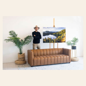 West Seattle artist Lars Gesing with his Mount Rainier art showing a photo of Summit Lake.