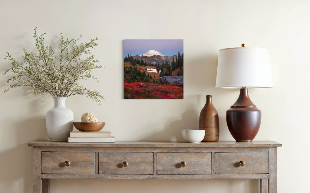 A piece of Mount Rainier art showing a Tipsoo Lake photo hangs in a dining area.