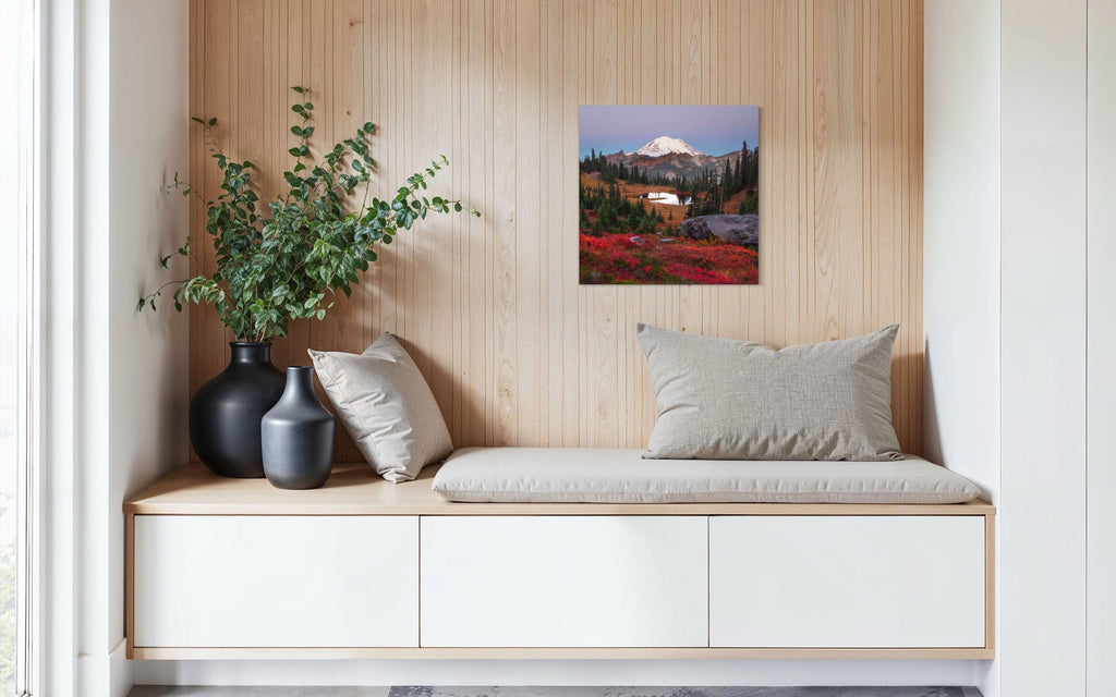 A piece of Mount Rainier art showing a Tipsoo Lake photo hangs in a sitting area.