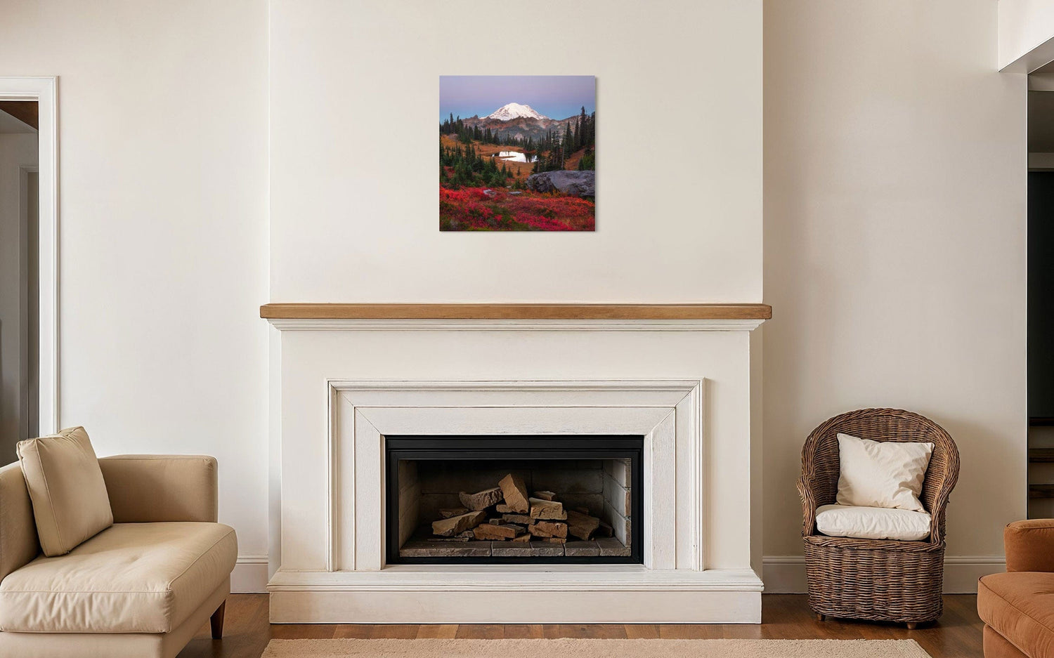 A piece of Mount Rainier art showing a Tipsoo Lake photo hangs above a fireplace.