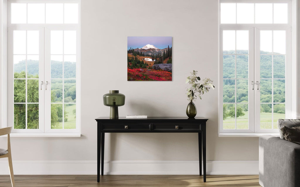 A piece of Mount Rainier art showing a Tipsoo Lake photo hangs in a living room.