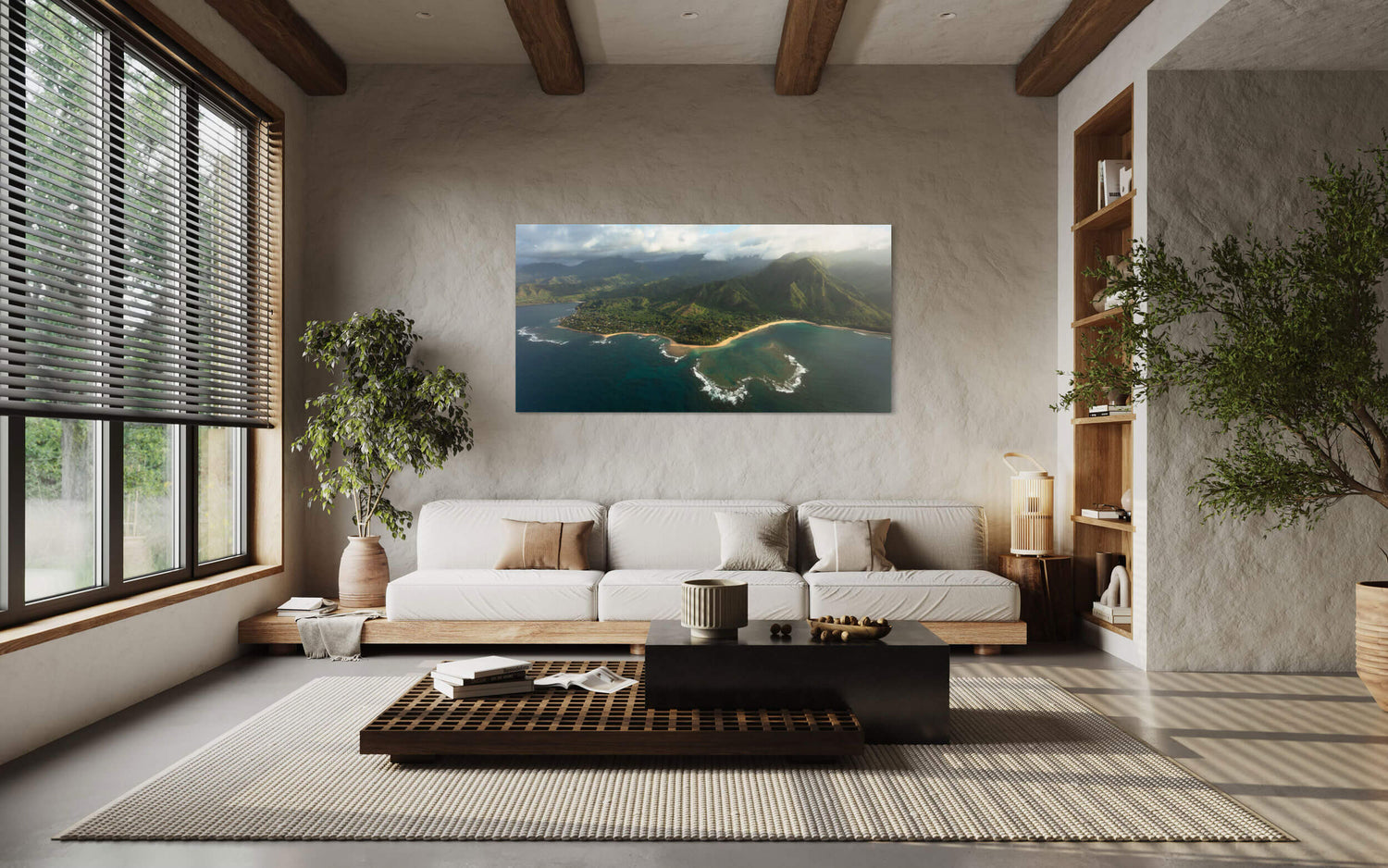 A piece of Napali Coast art showing a Ke'e Beach picture from Kauai hangs in a living room.