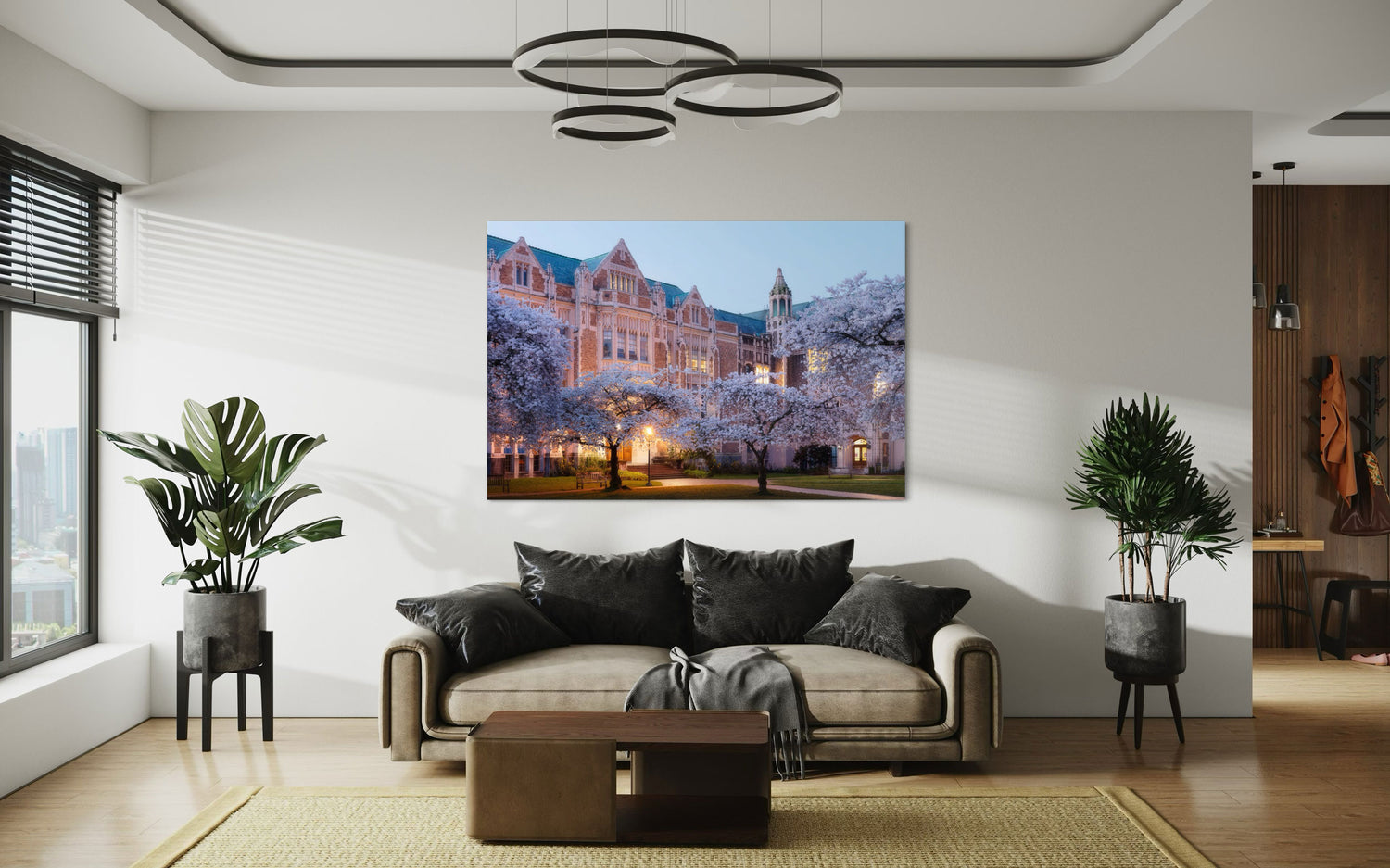 A piece of Seattle art showing the cherry blossoms on the UW campus hangs in a living room.