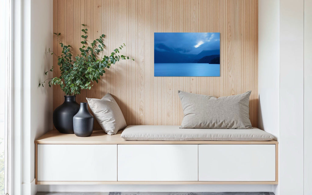 A piece of Vancouver Island art showing a lake photo hangs in a sitting area.