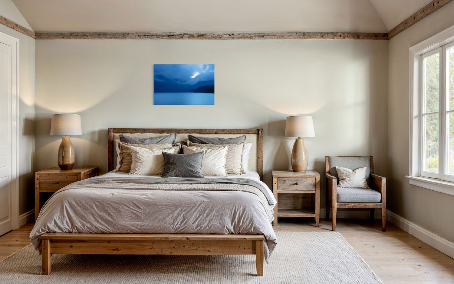 A piece of Vancouver Island art showing a lake photo hangs in a bedroom.