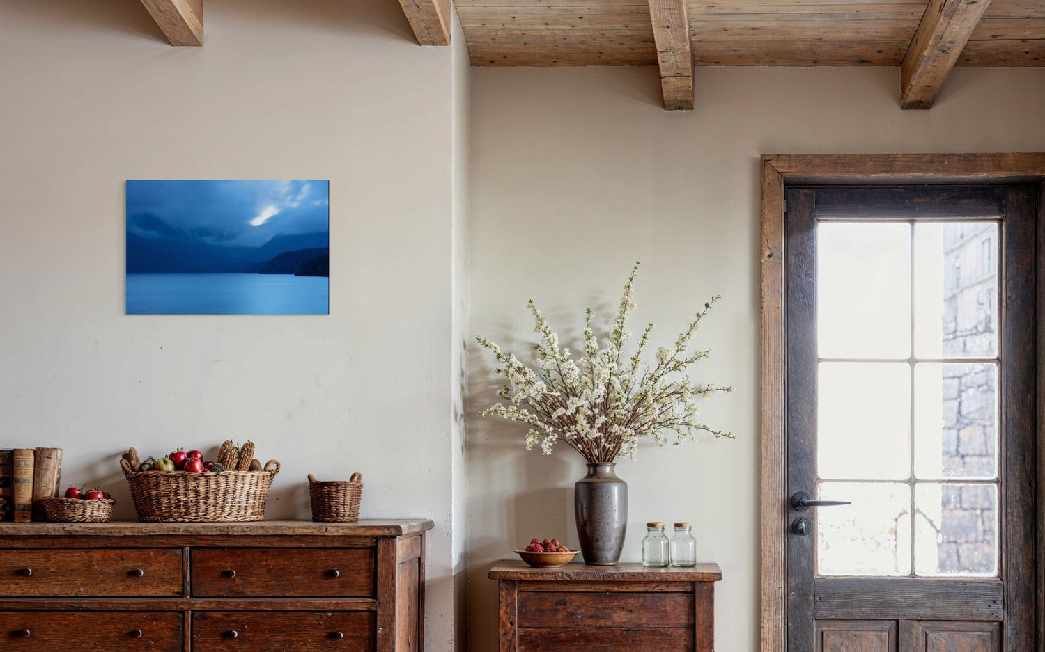 A piece of Vancouver Island art showing a lake photo hangs in an entryway.