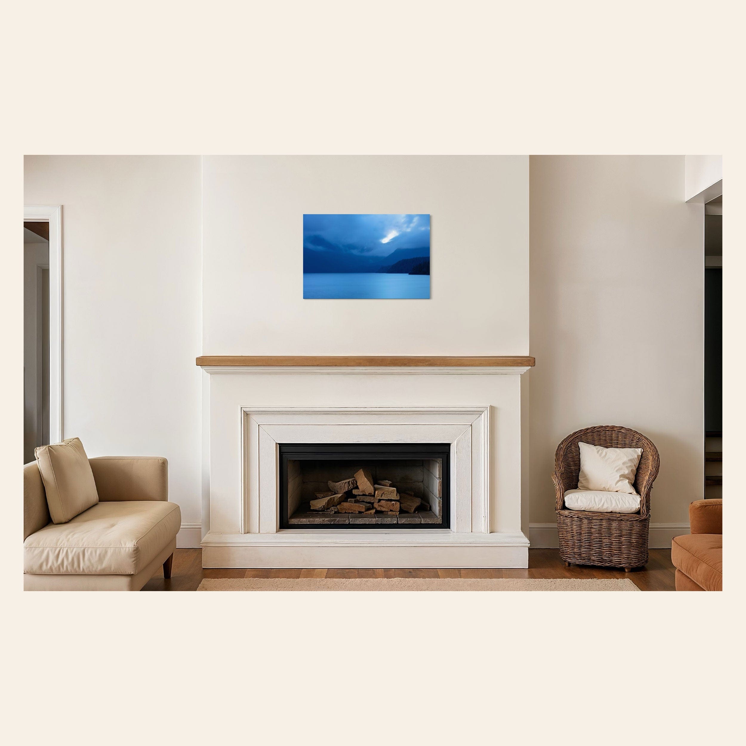 A piece of Vancouver Island art showing a lake photo hangs above a large fireplace.