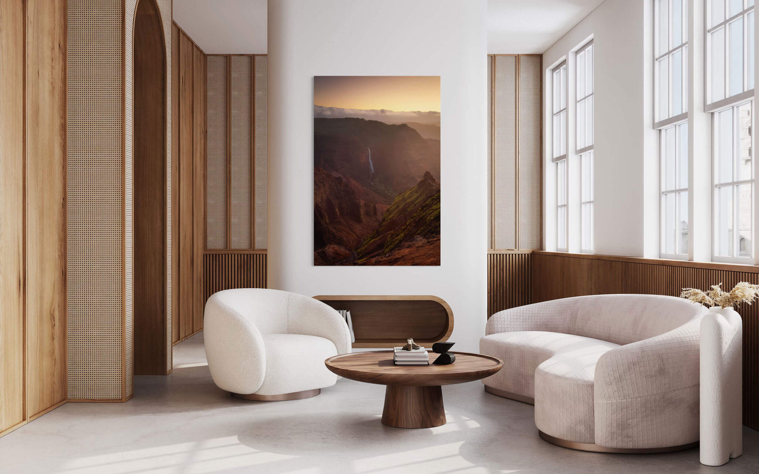 A Waimea Canyon sunrise picture from Kauai hangs in a living room.
