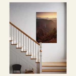 A Waimea Canyon sunrise picture from Kauai hangs in a hallway.