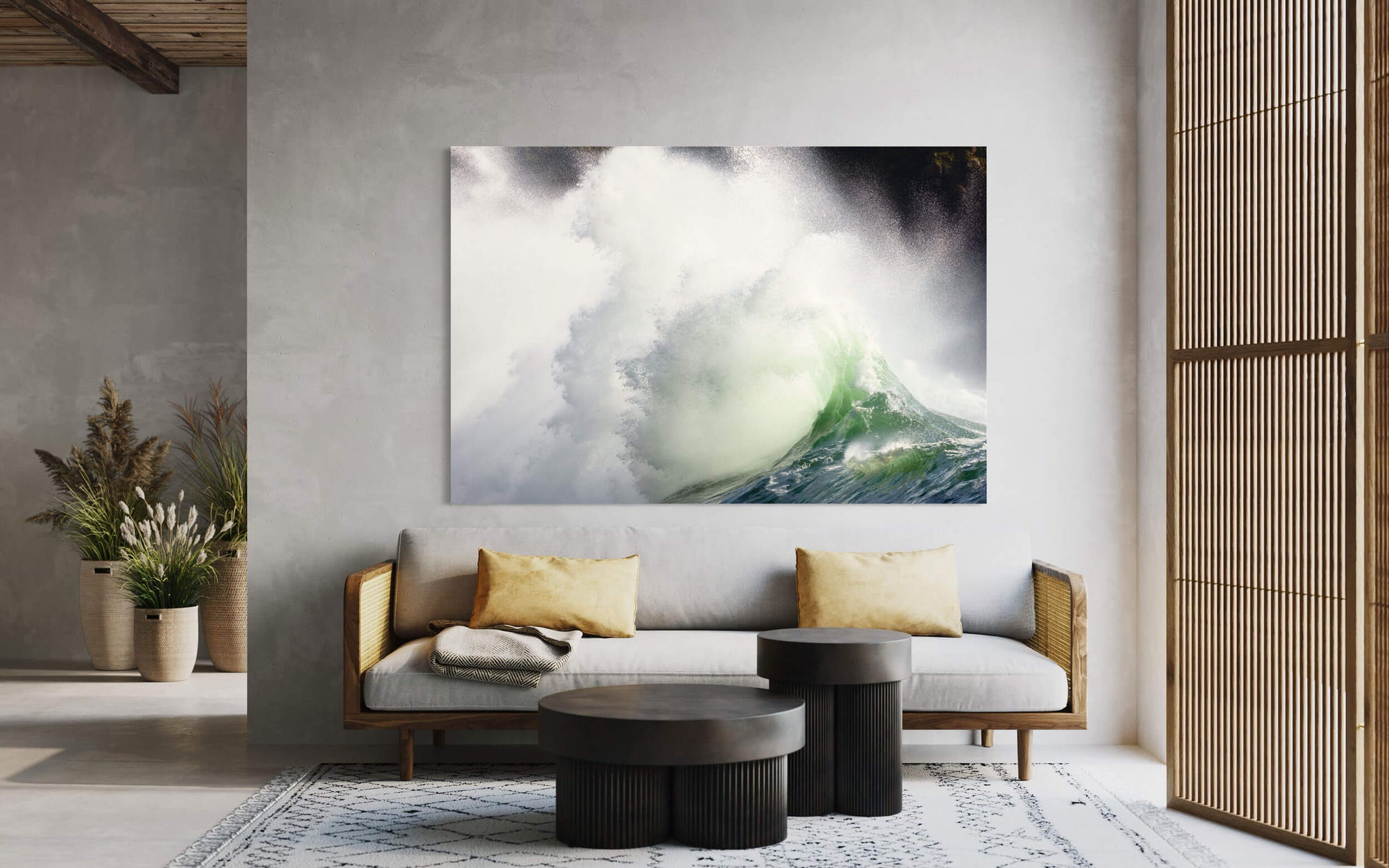 A piece of art showing a Cape Disappointment waves picture hangs in a living room.