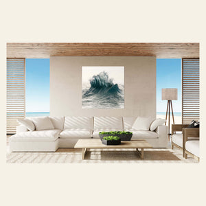 A wave picture of the ocean near Ke'e Beach on Kauai hangs in a living room.