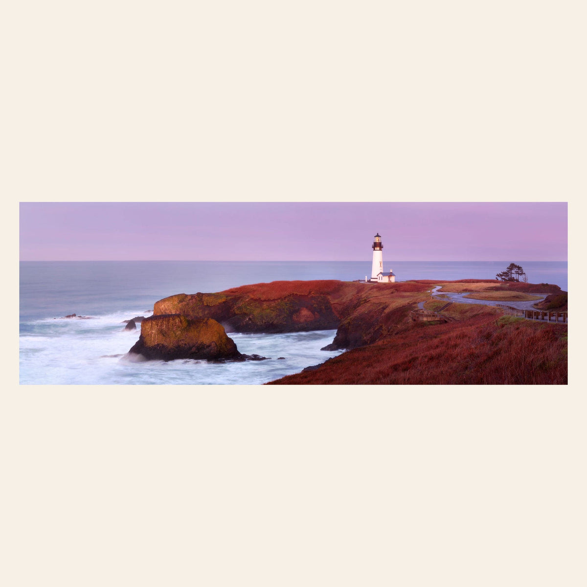 A piece of Oregon wall art shows a Yaquina Head Lighthouse photo.