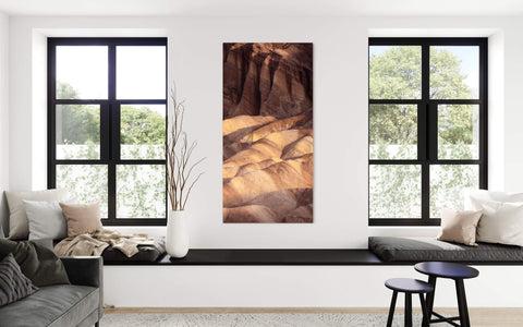 A Zabriskie Point picture from Death Valley National Park hangs in a living room.