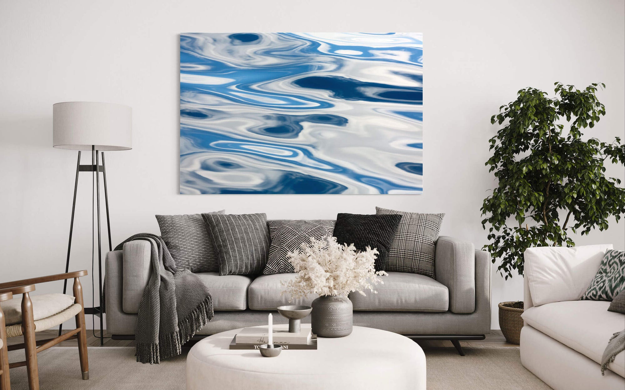 A piece of abstract Anacortes art showing a whale watching tour picture hangs in a living room.