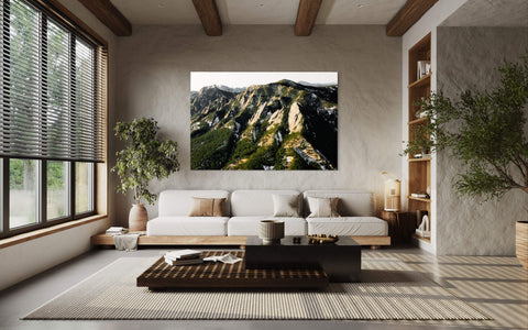 A Flatirons picture hangs in a living room as a piece of Boulder art.