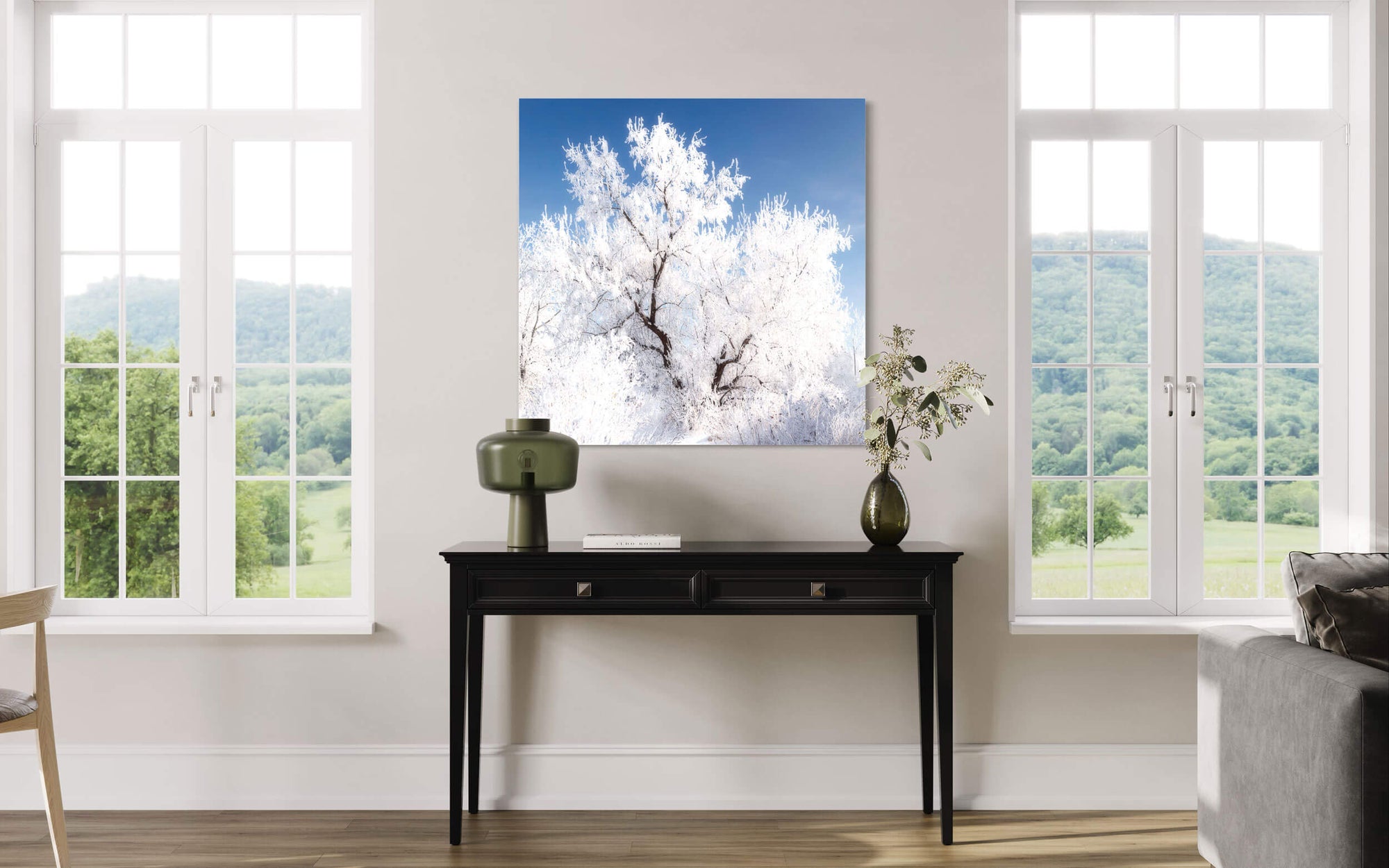 A piece of Boulder art showing a frozen tree in Colorado hangs in a living room.