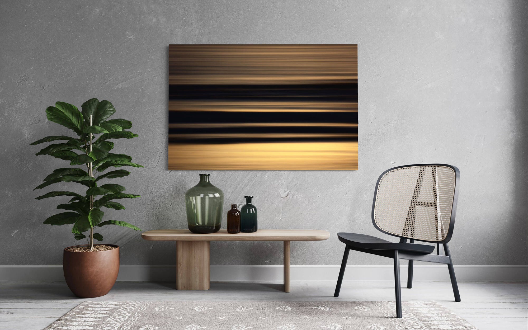 A piece of Cannon Beach art showing an abstract Oregon coast sunset hangs in a living room.