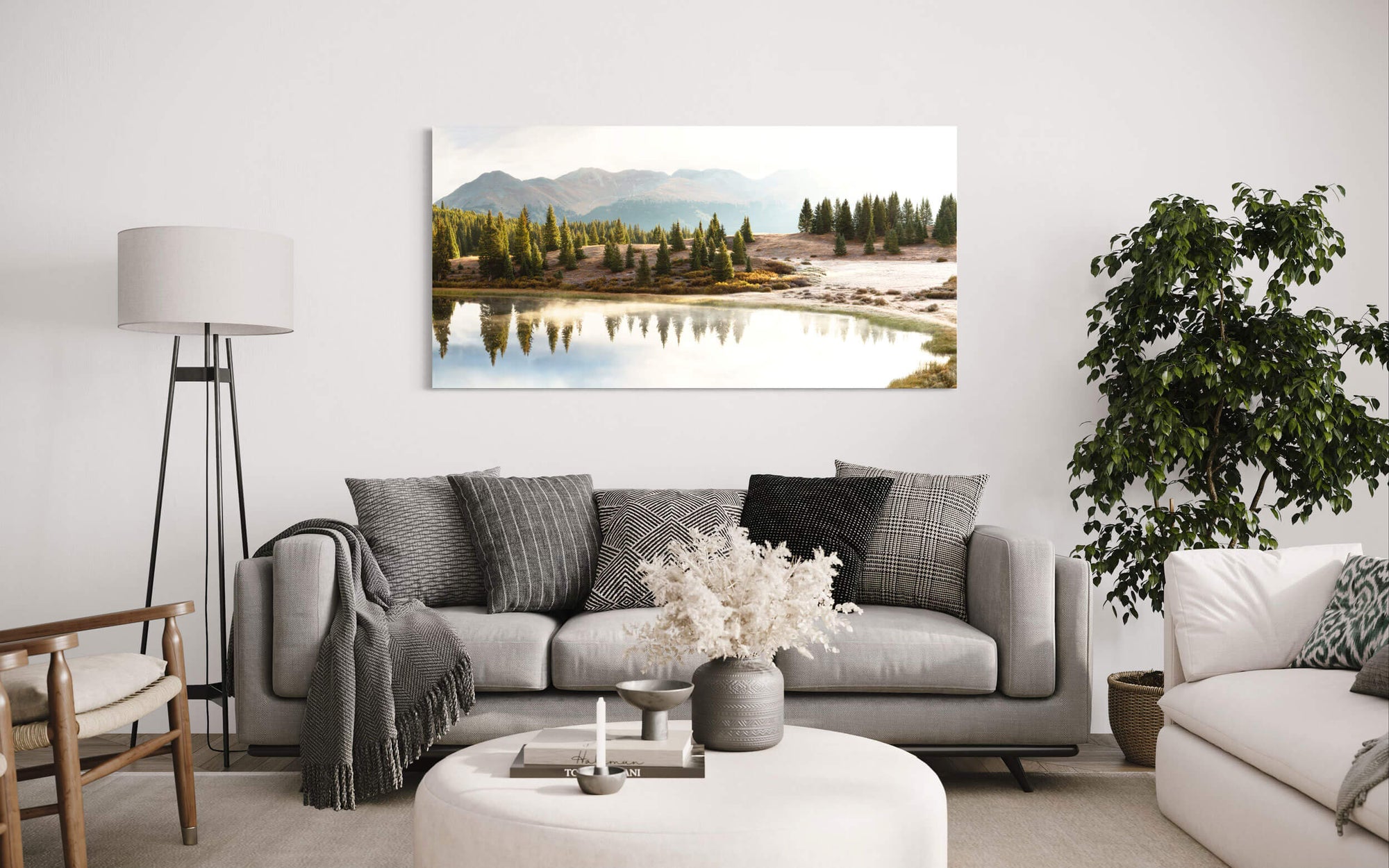 A piece of Colorado art showing the little Molas Pass Lake hangs in a living room.