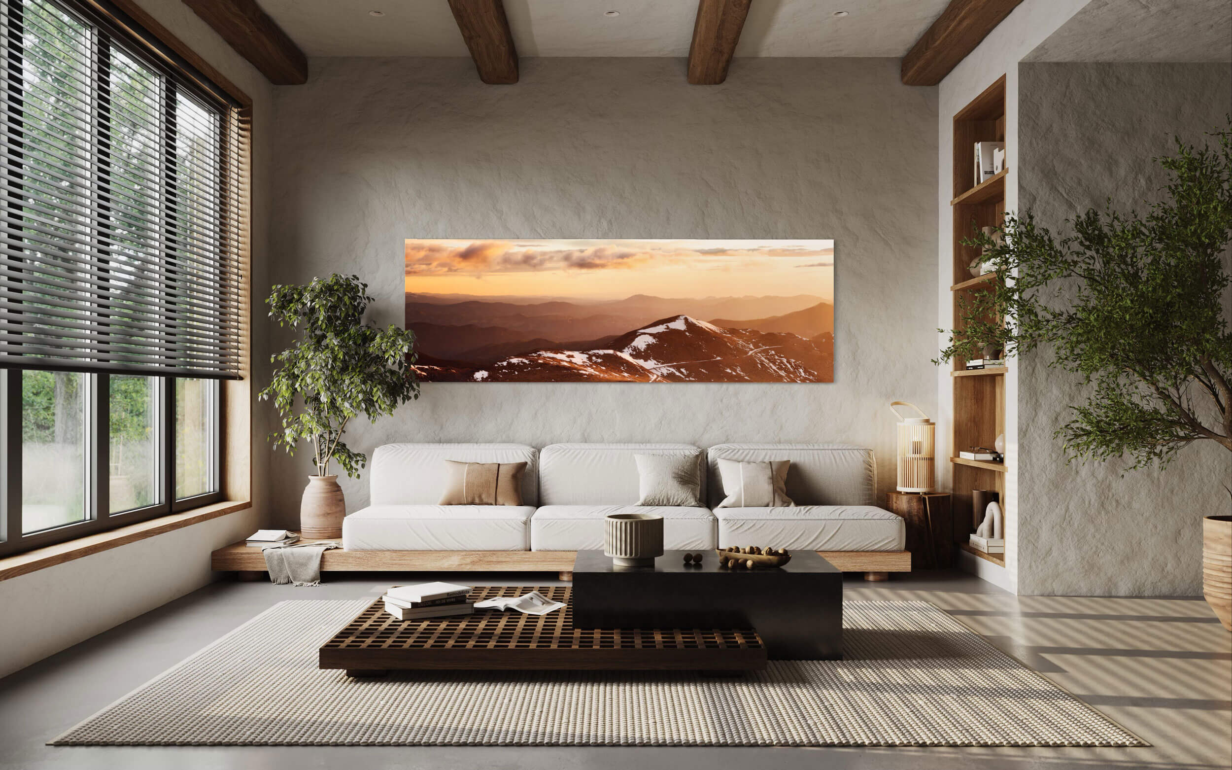 A piece of Colorado art showing a sunrise from Mount Evans hangs in a living room.