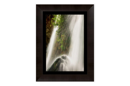 A piece of framed Colorado art shows the waterfall at Rifle Falls State Park.