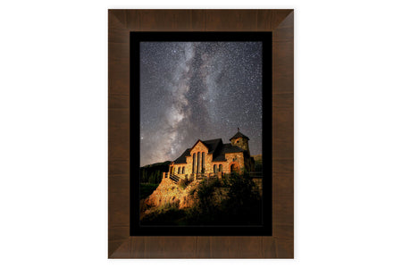 This framed piece of Colorado art shows the St. Malo's Chapel near Estes Park.