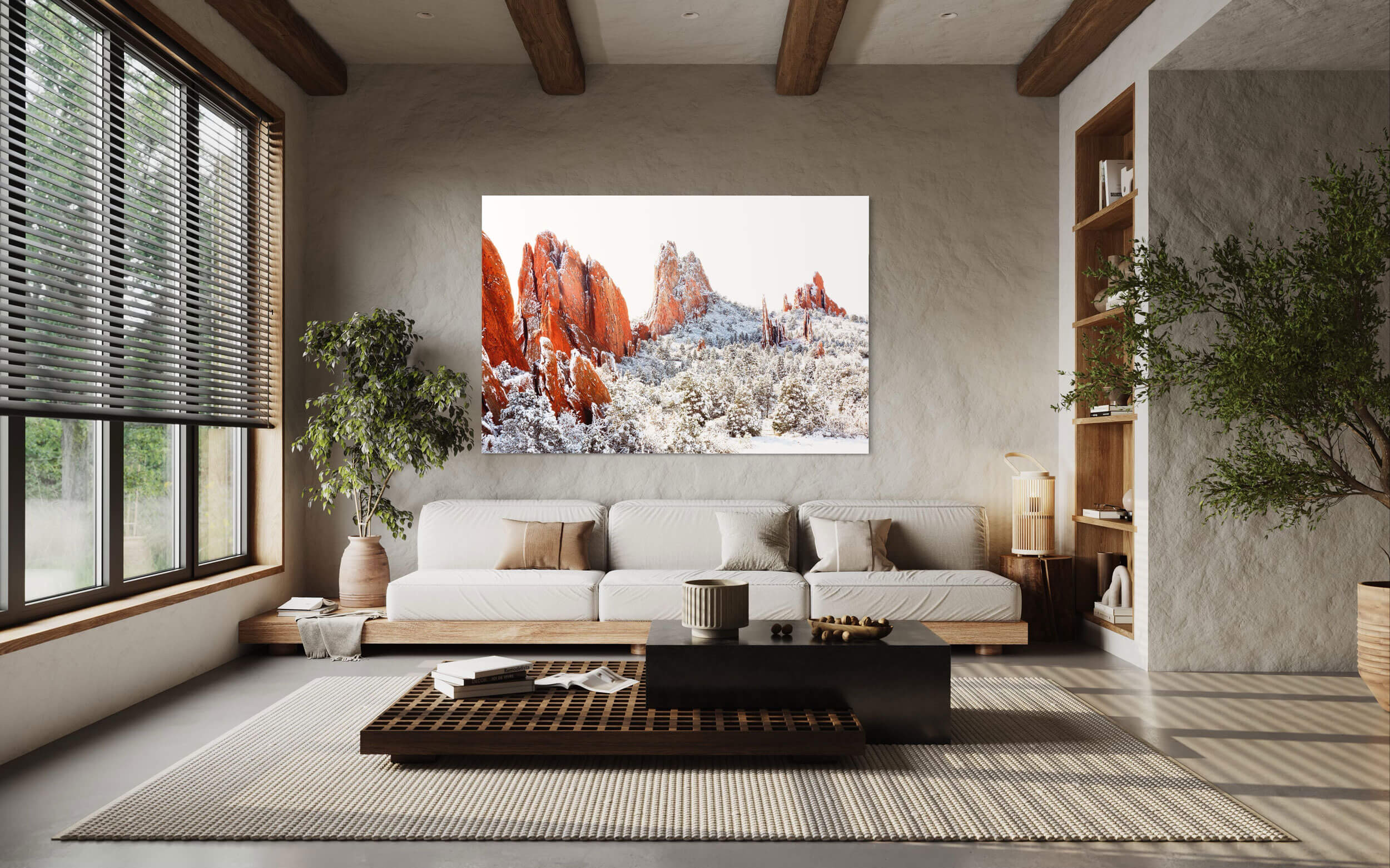A piece of Colorado Springs art showing the Garden of the Gods in winter hangs in a living room.
