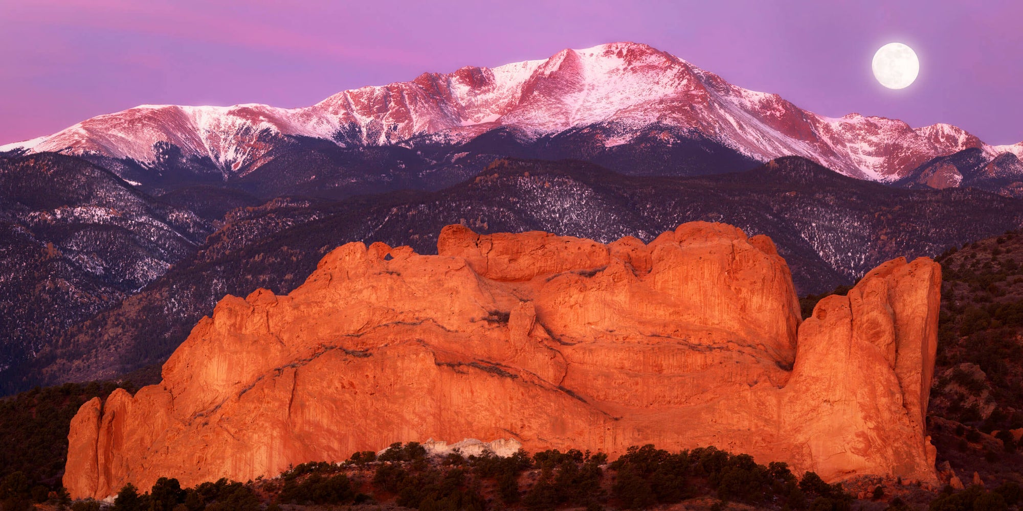 This piece of Colorado Springs art shows Pikes Peak behind the Garden of the Gods.
