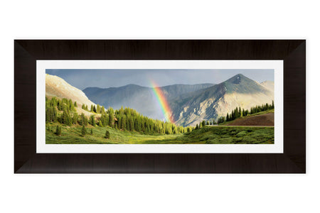 This piece of framed Colorado art shows a rainbow on Cottonwood Pass.