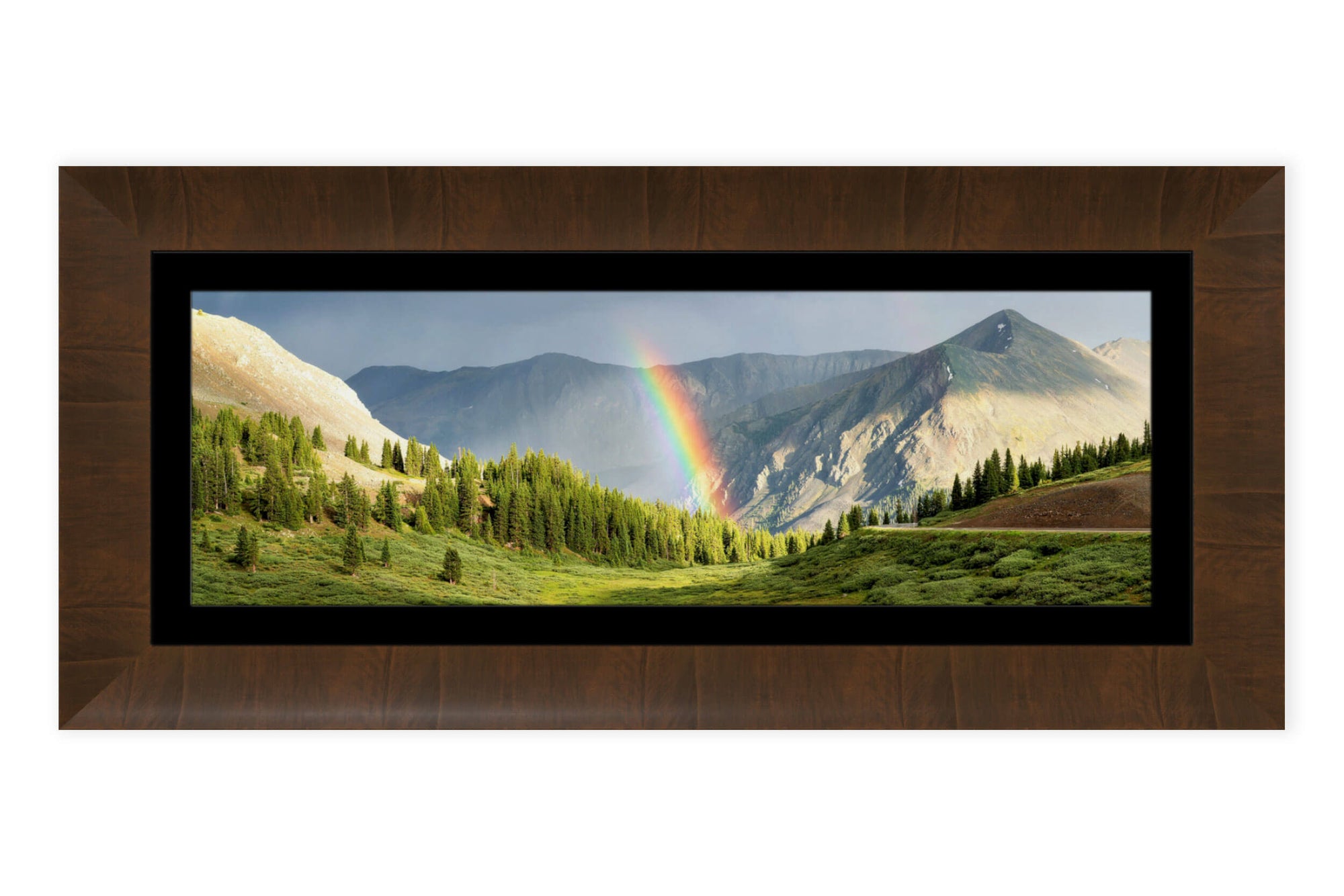 This piece of framed Colorado art shows a rainbow on Cottonwood Pass.