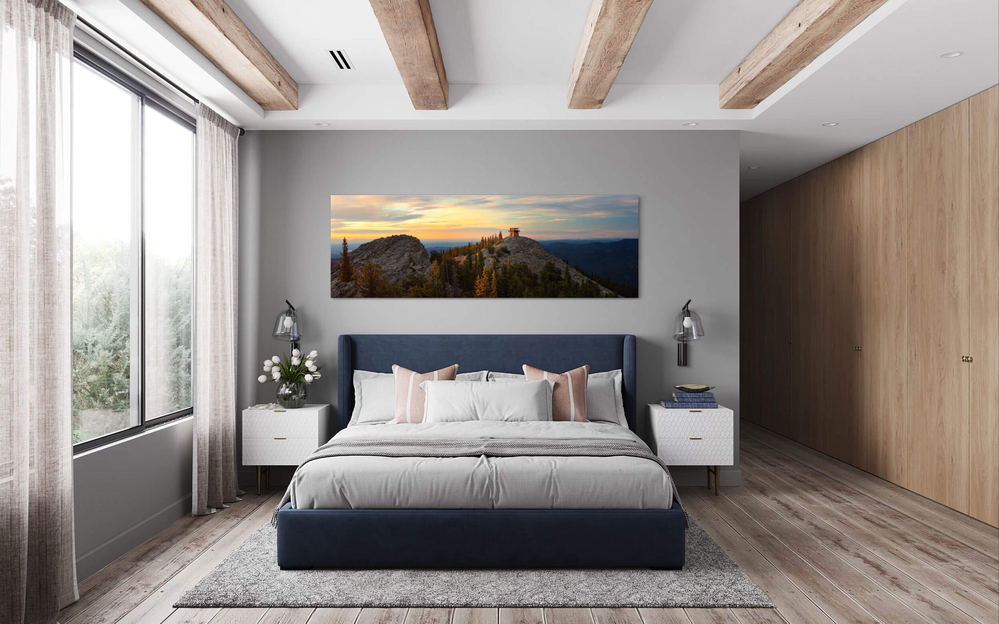 A piece of Denver art showing a fire lookout picture hangs in a bedroom.