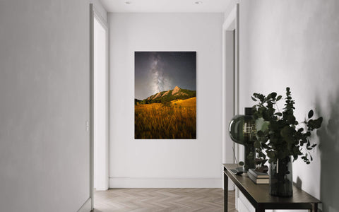 A piece of Boulder art showing the Flatirons in Colorado hangs in a hallway.
