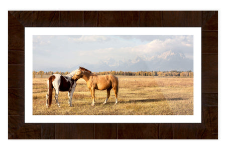 This piece of framed Jackson Hole art shows horses in Grand Teton National Park.