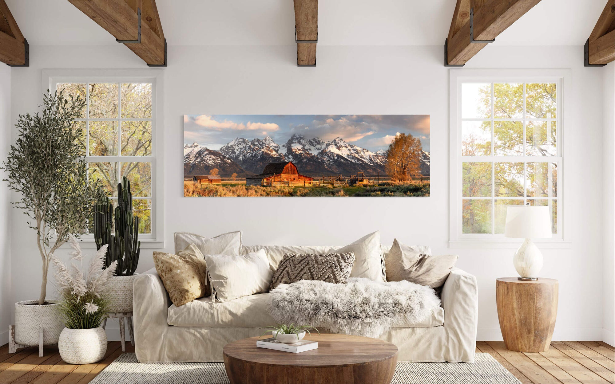 A piece of Jackson Hole art showing Grand Teton National Park hangs in a living room.