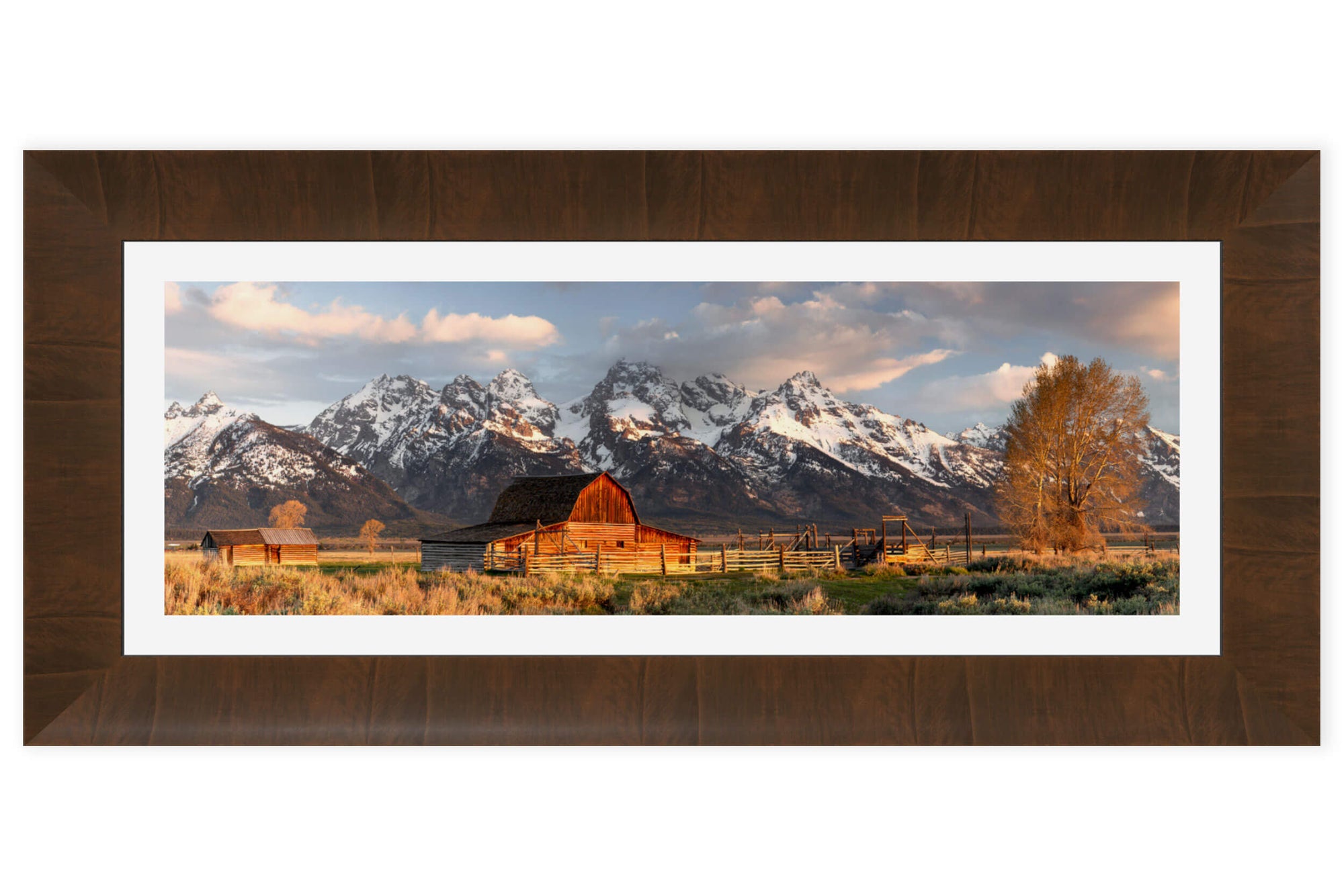 A piece of framed Jackson Hole art shows the barns at Mormon Row in Grand Teton National Park.