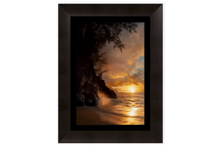 This piece of framed Kauai art shows a sunset picture from Hideaway Beach.