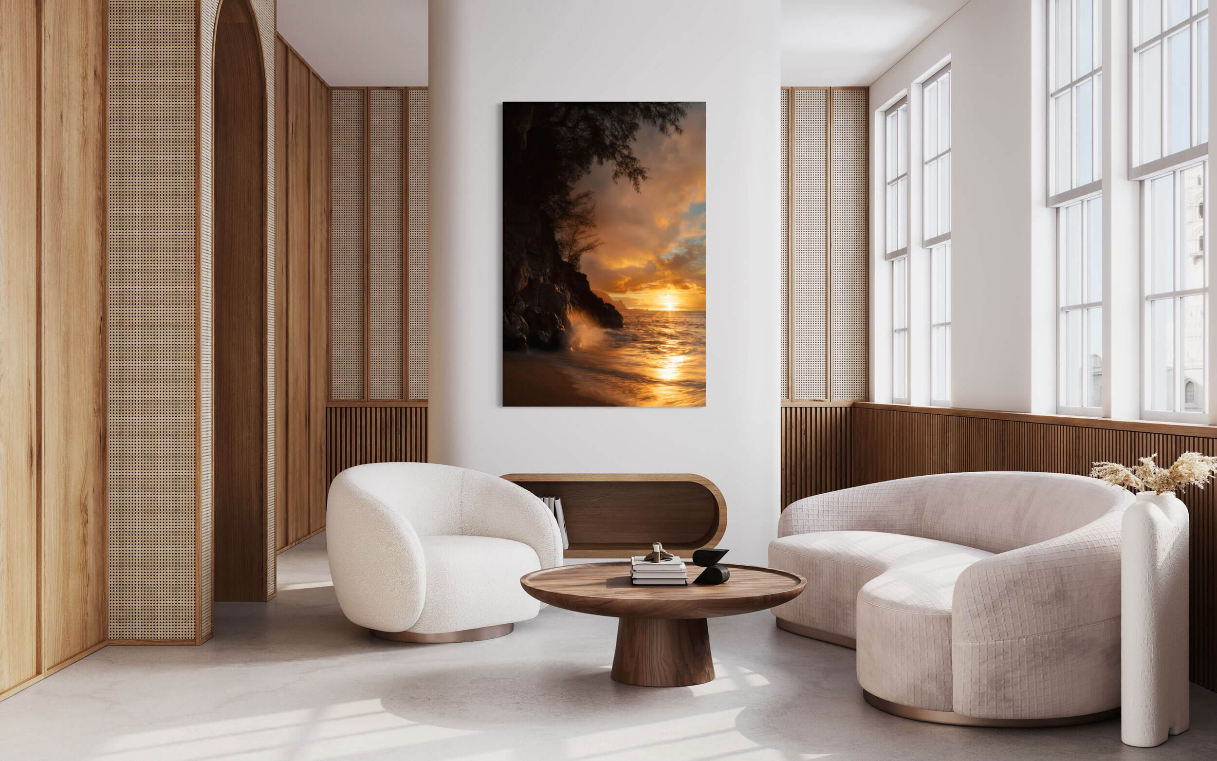A piece of Kauai art showing a sunset picture from Hideaway Beach hangs in a living room.